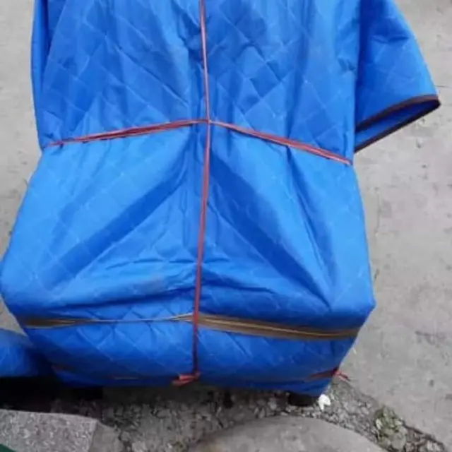 Blue sheet wrapped furniture – Nation Packers And Movers
