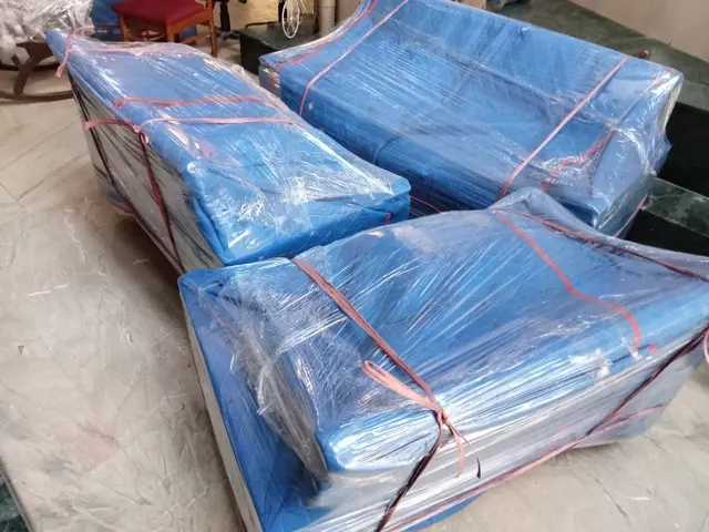 Blue wrapped bed and sofa parts – Nation Packers And Movers
