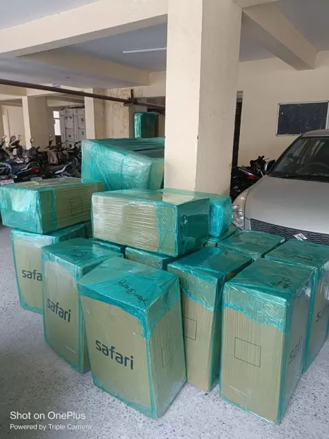 Packed goods in apartment parking – Nation Packers And Movers