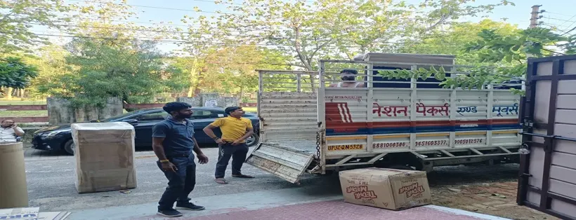 Loading packed household goods into a Nation Packers truck